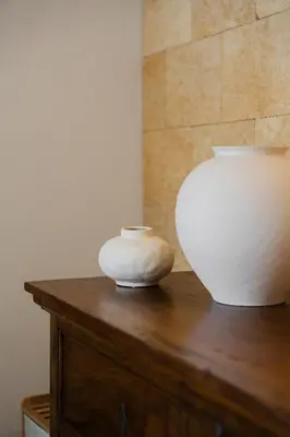 a white vase sitting on top of a wooden table at House sea view in Terrasini