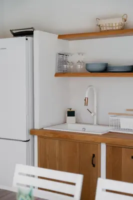 a kitchen with a sink and a refrigerator at House sea view in Terrasini