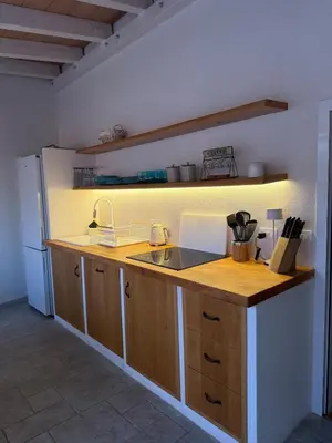 a kitchen with a sink and a refrigerator at House sea view in Terrasini