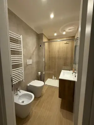 a bathroom with a sink and a toilet and a tub at Villa Anthea - Relax vista mare tra Palermo e Cefalù in Trabia