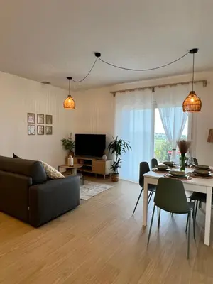 a living room with a couch and a table at Villa Anthea - Relax vista mare tra Palermo e Cefalù in Trabia