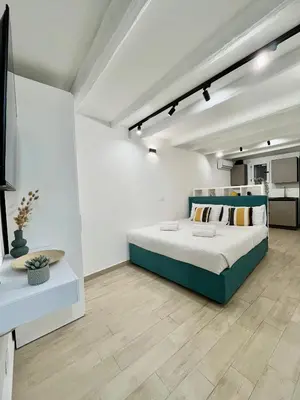 a bedroom with a large bed in a room at La dolce casa in Palermo