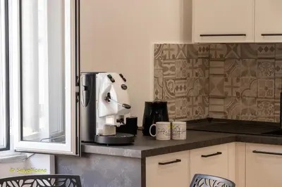 a kitchen with a coffee maker on a counter at GAle Apartment in Palermo