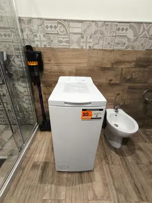 a white toilet and a sink in a bathroom at GAle Apartment in Palermo