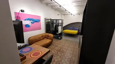 a room with a couch and a table and a bed at Suitt Drims 8 in Palermo