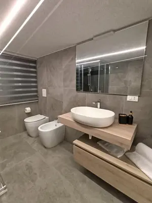 a bathroom with a sink and a toilet at Home Luxury Felice Marine in Palermo