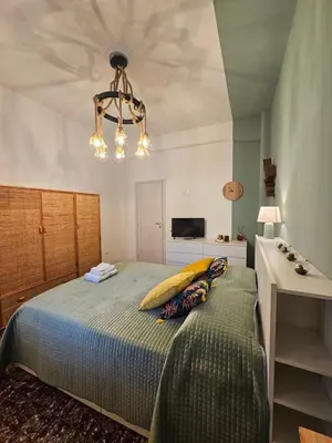a bedroom with a bed with a pillow on it at Oasi Ballarak in Palermo