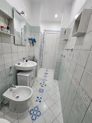 a bathroom with a sink and a toilet at Oasi Ballarak in Palermo