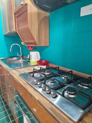 a kitchen with a stove and a sink at Oasi Ballarak in Palermo