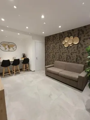 a living room with a couch and a table at Home Luxury Felice in Palermo