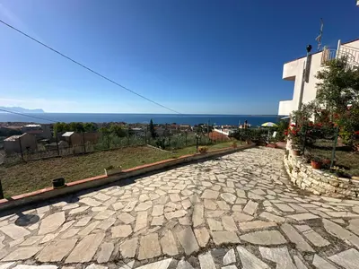 a cobblestone street in front of a building at Villa Belvedere in Partinico