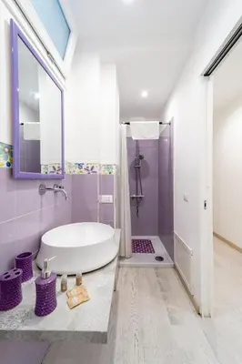 a bathroom with a white tub and a shower at Casa Giulù in Palermo