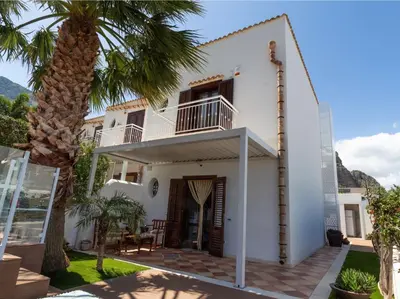a villa with a view of the front of the house at Anemos Apartment - Villa Sole in Macari