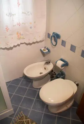 a bathroom with a toilet and a sink at Anemos Apartment - Villa Sole in Macari