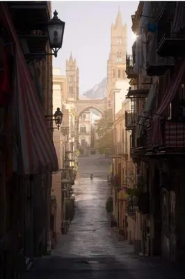 an alley with a person walking down a street at Maddy Luxury Apartment in Palermo