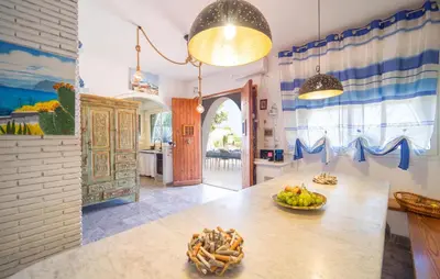 a kitchen with a table with a bowl of fruit on it at 3 Bedroom Lovely Apartment In Trappeto in Trappeto
