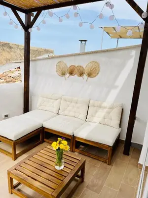 a living room with a couch and a table at Loft Al Baglio del Gelso in Balestrate
