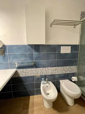 a bathroom with a toilet and a bidet at Loft Al Baglio del Gelso in Balestrate