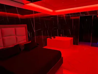 a bedroom with red lighting and a bed and chairs at Luxurymimi in Palermo