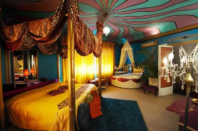a bedroom with a bed in a room with a ceiling at Sultan Suites in Palermo