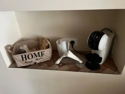 a corner of a room with a home sweet shop bag on the floor at Infiniti noi home in Palermo