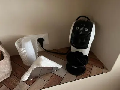 a black and white blender sitting on the floor at Infiniti noi home in Palermo