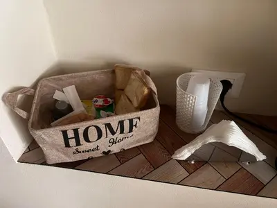a bag of items on a floor next to a wall at Infiniti noi home in Palermo