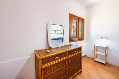 a mirror on top of a dresser in a room at Villa Casty with private pool in Trabia