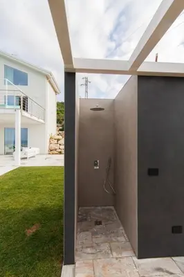 a shower in the backyard of a house at White Luxury Villa by Le Dhome Sicily in Partinico