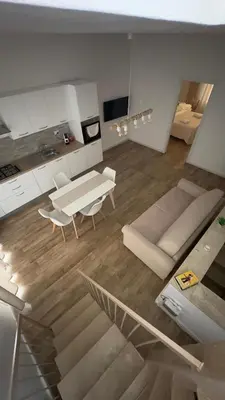 a living room with a couch and a table at Mahalo in Palermo