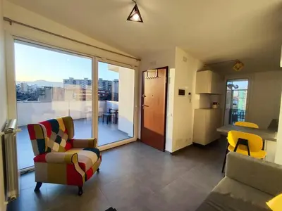 a living room with a view of a city at QASA apartment with terrace, Palermo center in Palermo
