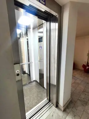 a glass door in a building with a hallway at QASA apartment with terrace, Palermo center in Palermo