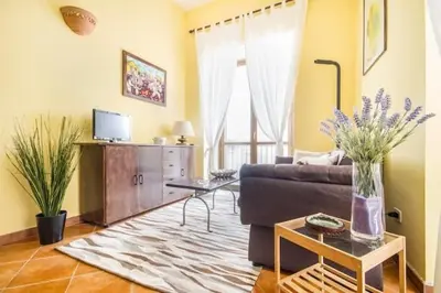 a living room with a couch and a table at La Casetta del Vicolo in Palermo