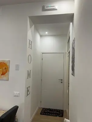 a hallway with a door in a room at Casa Annachiara in Palermo