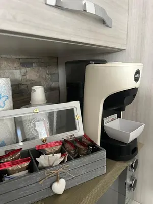 a sewing machine sitting on a shelf next to a box at Casa Annachiara in Palermo