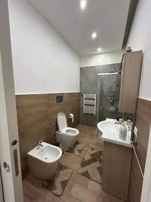 a bathroom with a toilet and a sink at Casa Annachiara in Palermo