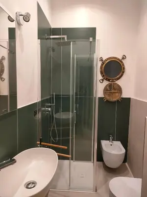 a bathroom with a shower and a toilet and a sink at B&B Duca di Maqueda nel pieno centro dell citta' a 5 minuti dalla stazione degli autobus e dei treni in Palermo