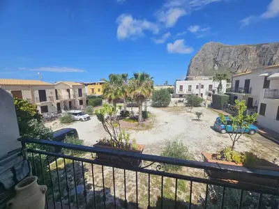 a balcony with a view of a parking lot at David's Apartment in San Vito lo Capo