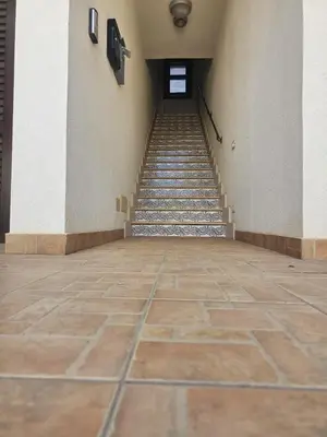 an empty hallway with stairs in a building at David's Apartment in San Vito lo Capo