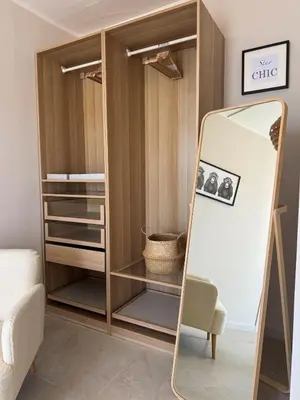 a dressing room with a mirror and a chair at Casa Tulum - Sea View & Breakfast in Palermo