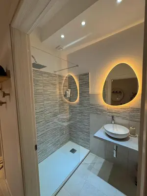 a bathroom with a sink and a mirror at Casa Tulum - Sea View & Breakfast in Palermo