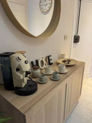 a coffee machine sitting on top of a counter with cups at Casa Tulum - Sea View & Breakfast in Palermo