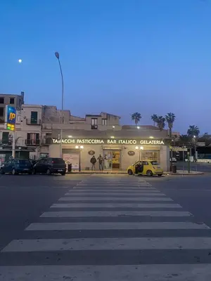 a street with a crosswalk in front of a building at Casa Tulum - Sea View & Breakfast in Palermo