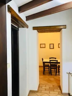 a dining room with a table and chairs at Apartment Via Vittorio Emanuele & Vucciria in Palermo