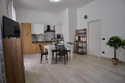 a kitchen and dining room with a table and chairs at Harmony Lux in Bagheria