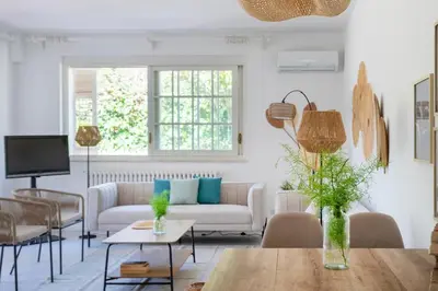a living room with a couch and a table at Donna Amalia villa in Mondello in Palermo