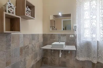 a bedroom with a bed with two towels on it at GuestHost - Ballarò Flat dei Sovrani x6 in Palermo