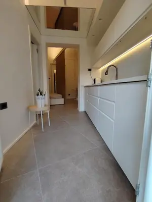 a kitchen with a sink and a counter top at Cappuccetto Rosso Sweet Apartment Palermo in Palermo