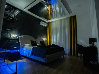 a bedroom with a bed with two laptops on it at Amuri Luxury Palermo centro in Palermo