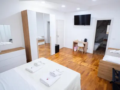 a room with a bed and a table with towels at Amuri Luxury Palermo centro in Palermo